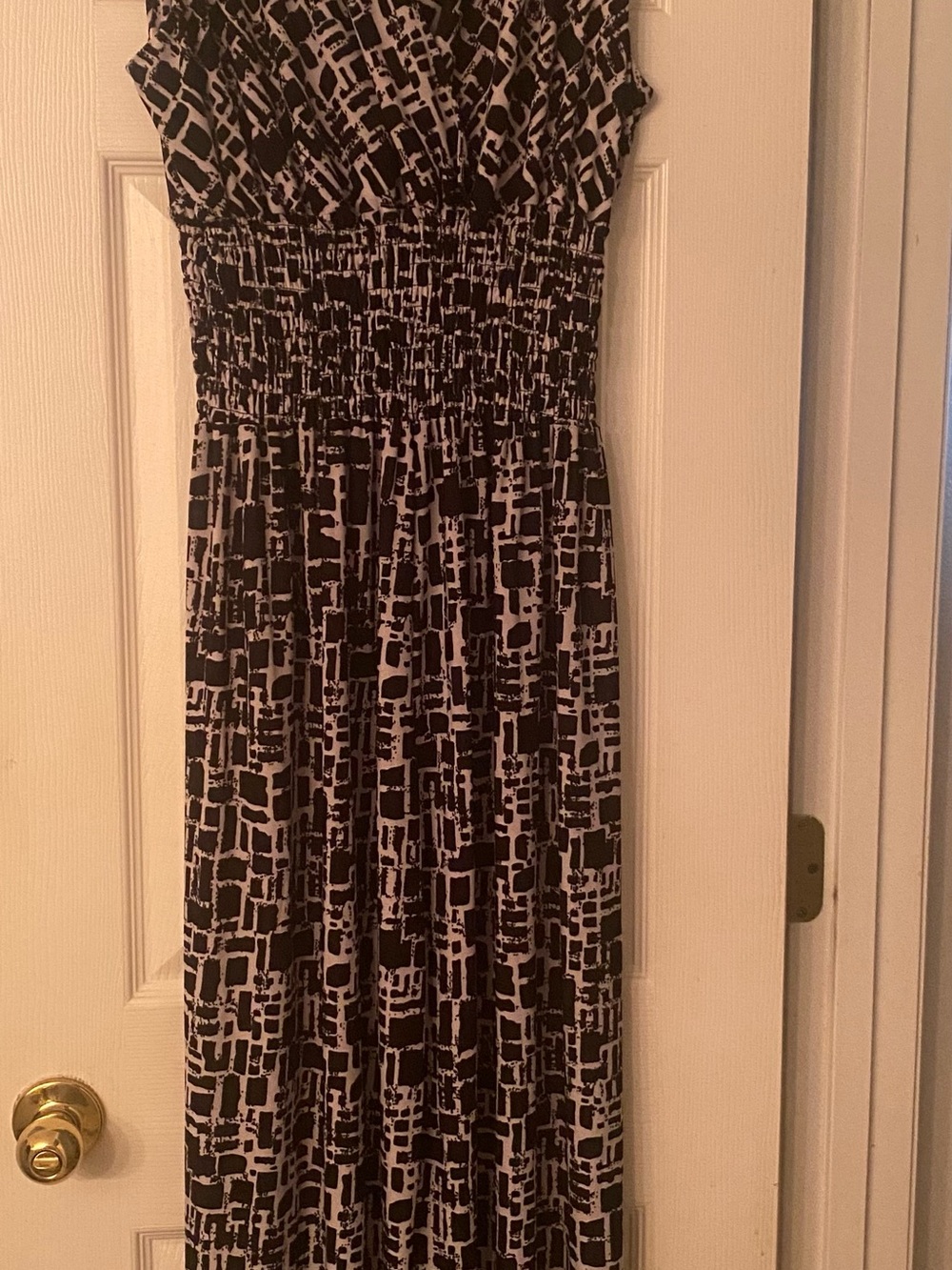 Sleeveless Black and White Printed Smocked-Waist Jumpsuit
